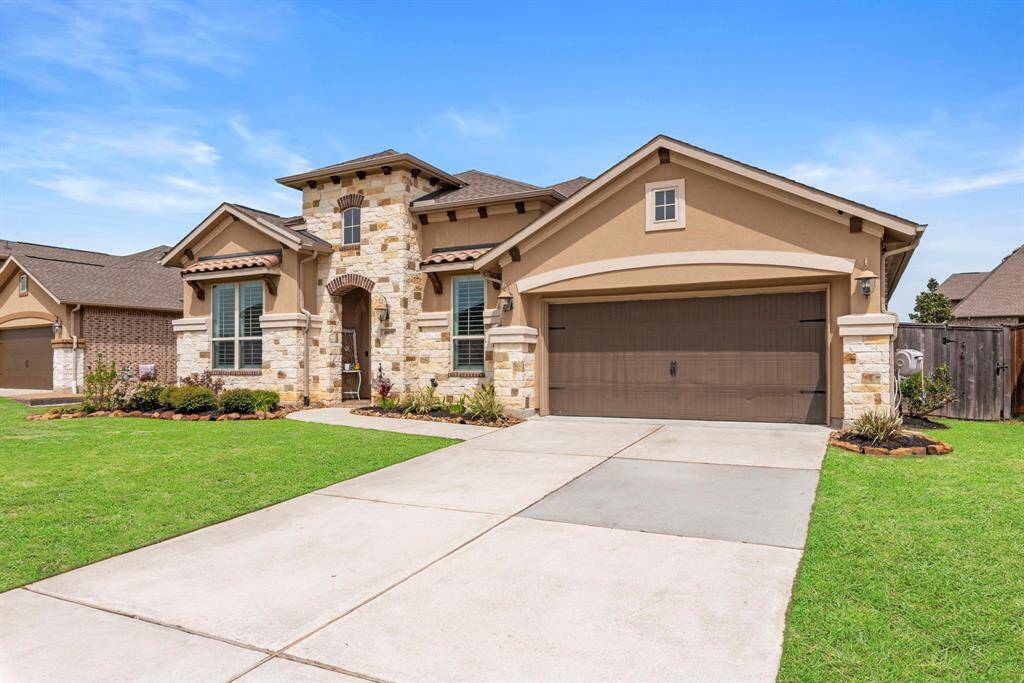 Discover curb appeal at its finest with this remarkable home, featuring a spacious 3-car garage tandem with stucco and stone elevation.