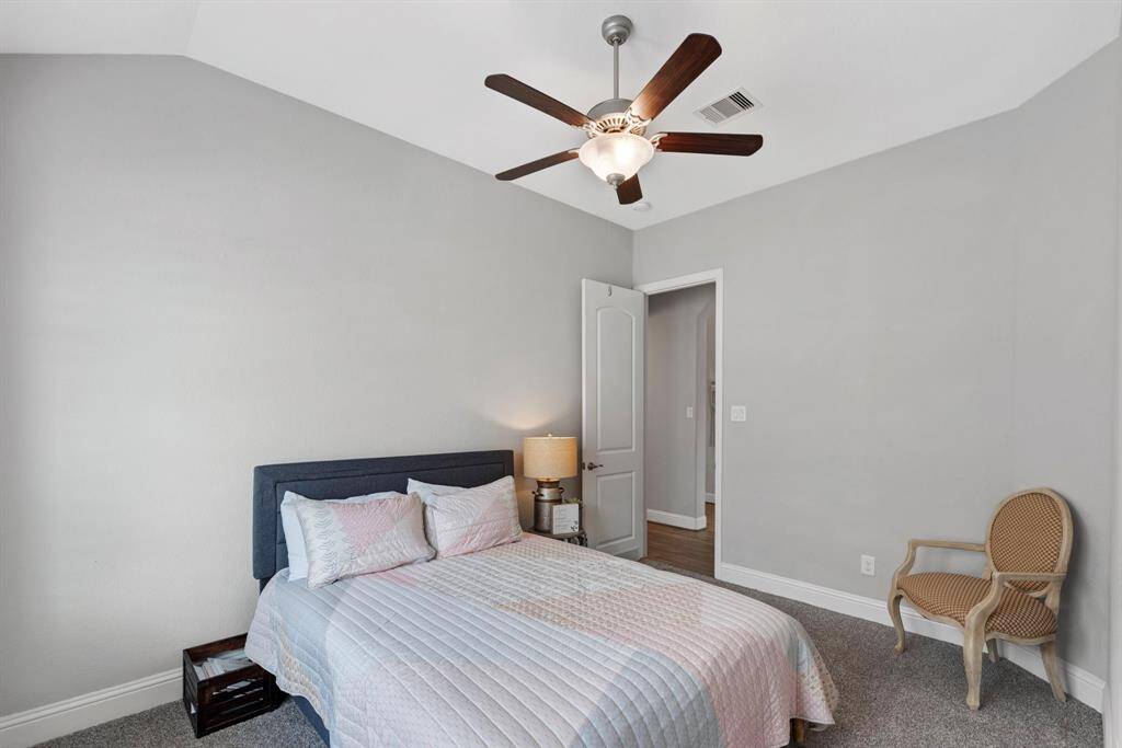 Spacious secondary bedroom. This secondary bedroom offers comfort and versatility, featuring ample space and natural light.