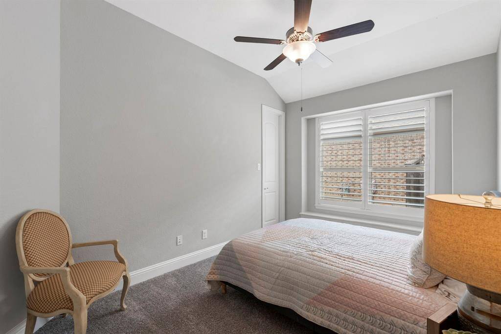 The secondary bedroom features a nice-sized walk-in closet for ample storage. Whether used as guest room, office, or personal retreat, this space is designed to fit your needs.