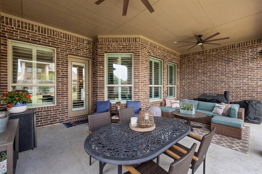 Spacious oversized patio perfect for entertaining, pre-wired for speakers to enhance your gatherings. The best part? This incredible outdoor space faces north and south, offering a cooler, more comfortable patio area year-around.