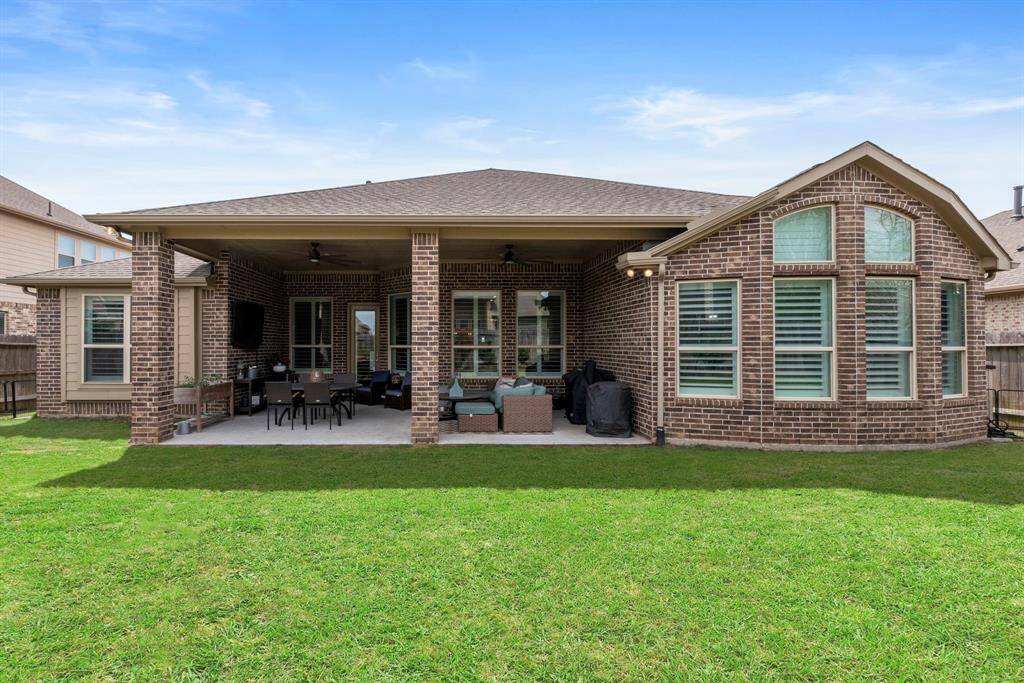 Another view of expansive back patio featuring a built-in gas line ideal for a grill, fire pit or outdoor kitchen. Whether hosting friends and family or enjoying a quiet evening, this versatile patio provides the perfect setting. With ample space and seamless access to the backyard, it's an entertainer's dream!