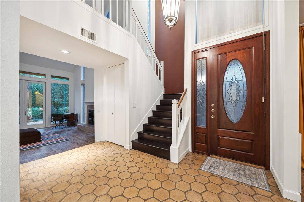 Open and welcoming Foyer with high ceilings and Saltillo tile