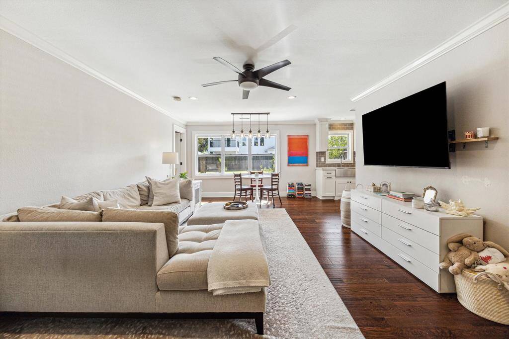 The living room is filled with natural light, offering a perfect space for relaxation and entertaining.