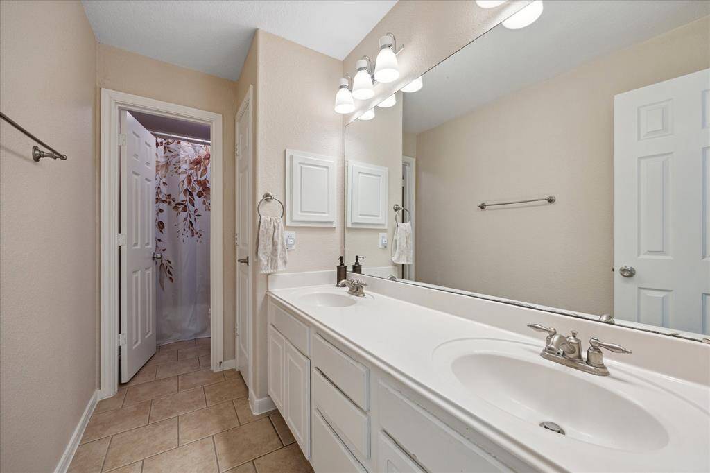 Upstairs bathroom features double sinks, and separate door to tub and toilet area, which makes it easy for multiple people to use at the same time.