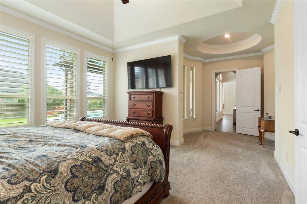 Luxurious primary bedroom featuring an elegant rotunda sitting area.