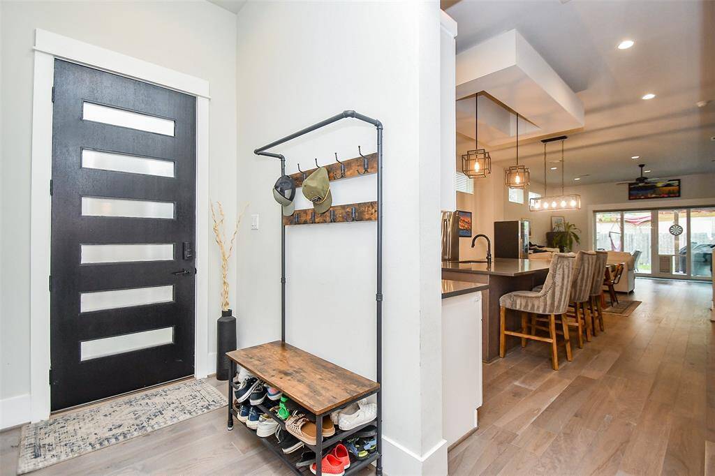 Step into a warm and inviting entryway that instantly feels like home. To the left is entrance to the 2 car garage.