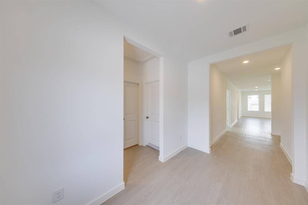 Welcoming entry hall with plenty of space, creating a grand first impression and a smooth transition into the home!