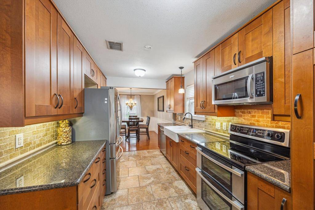 Loads of cabinets in the handsome kitchen.