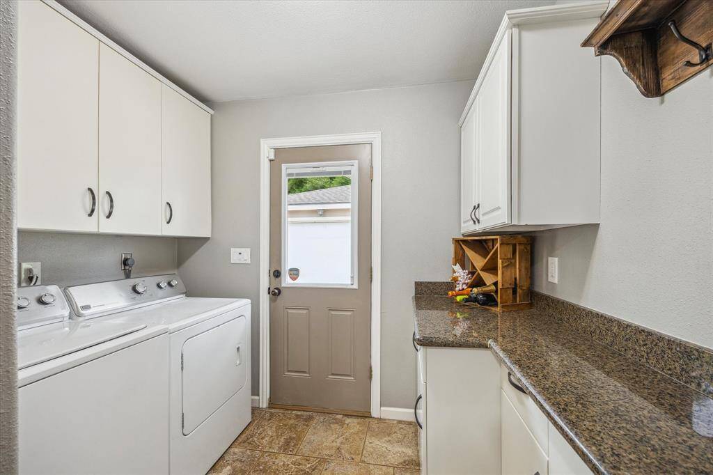 Utility room with good cabinet space.