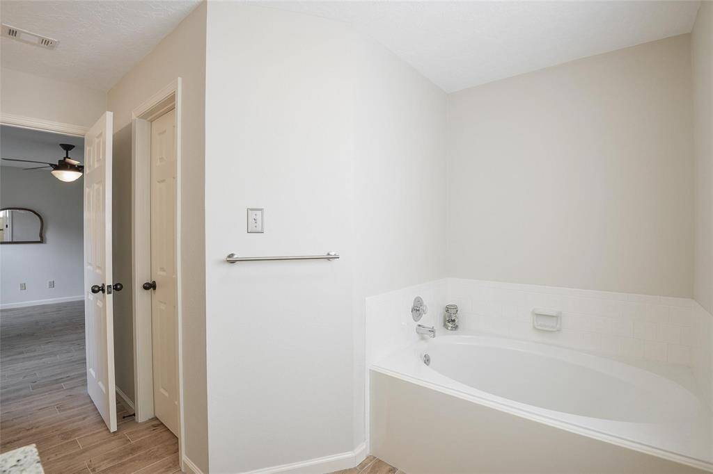 Updated Primary Bathroom has Large Soaking Tub.
