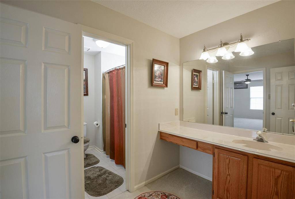 Secondary Bathroom with Vanity.