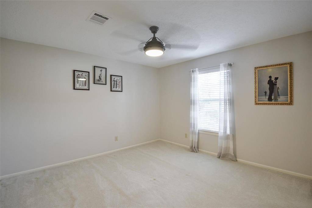 Secondary Bedroom with Ceiling Fan.