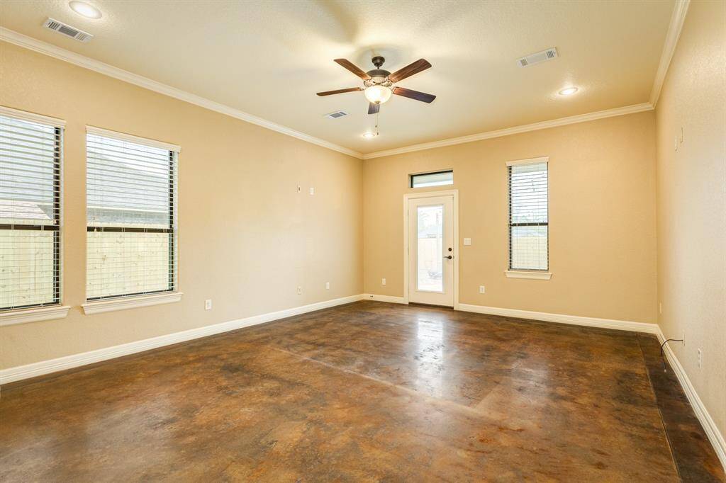 Stained concrete floors throughout offer a timeless and durable aesthetic