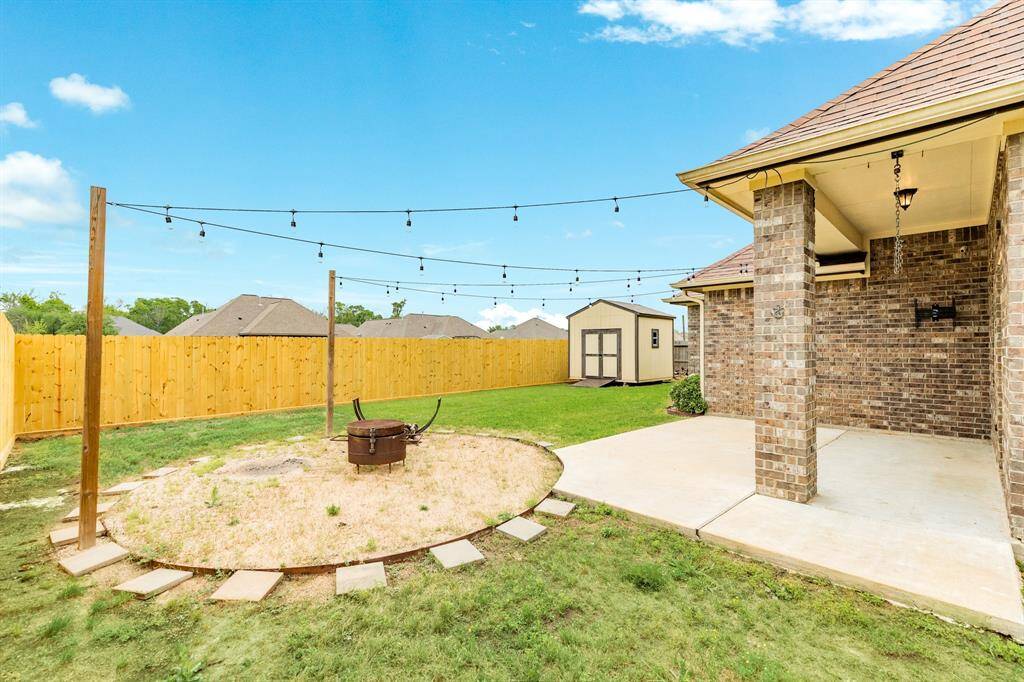 Spacious back yard with no back neighbors offering added privacy. The fire pit area at night is the perfect place to unwind.