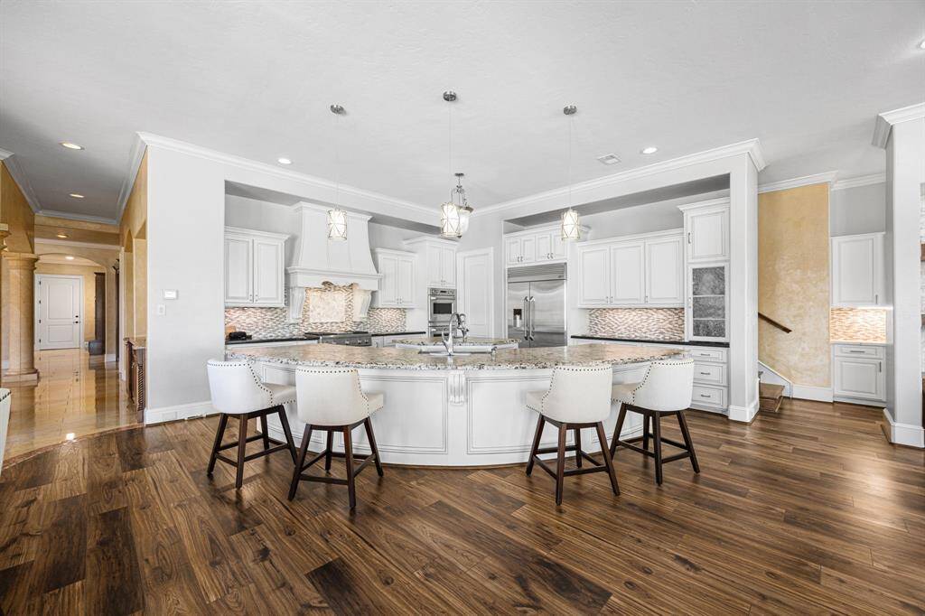 An integral part of the home, this Epicurean kitchen is a well-equipped space adorned with luxury elements, old-world details, layered textures, custom finishes & professional grade appliances.
