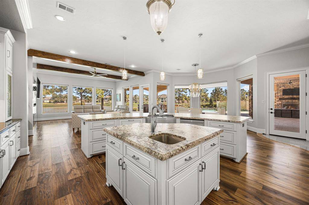 Picturesque views from every angle surround the kitchen & family room with beautiful natural light that envelops the space.