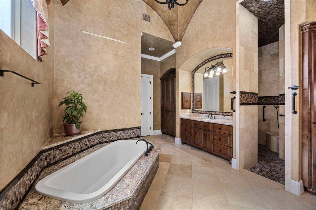 Relax in a Roman soaking tub or reenergize in the sizable spa shower offering a dual rain shower system.