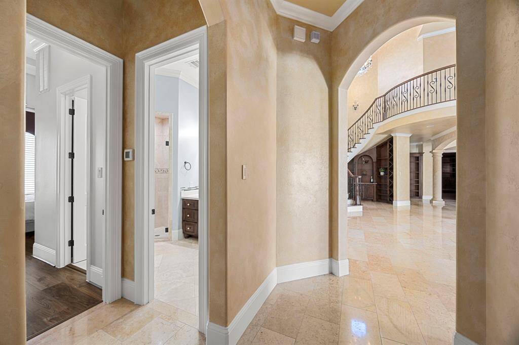The private vestibule entry transitions to the second bedroom suite adorned with luxe details.