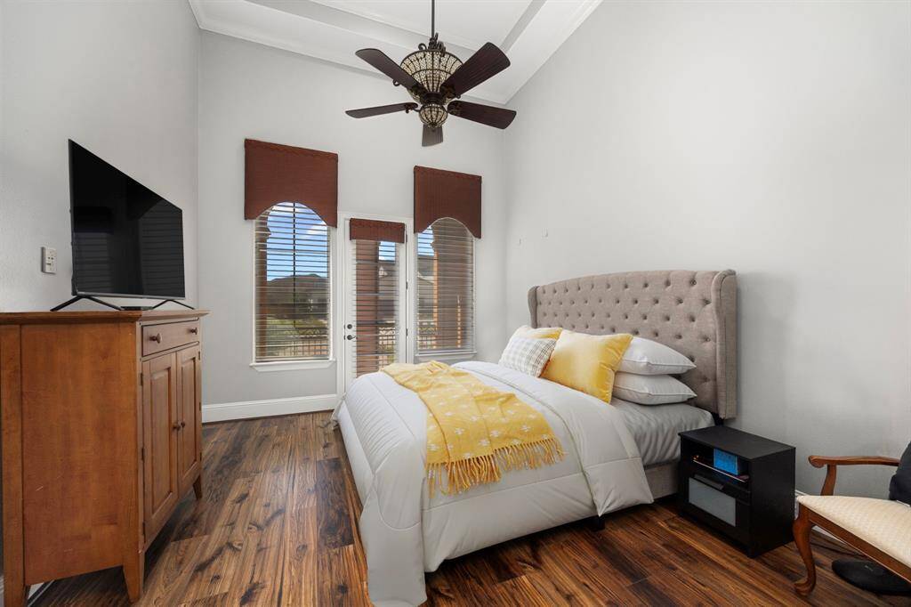 Bedroom Suite 2 offers a private terrace with the soft glow of the setting sun. Towering tray ceilings, luxury flooring & a custom designed closet add the lavish details you expect.