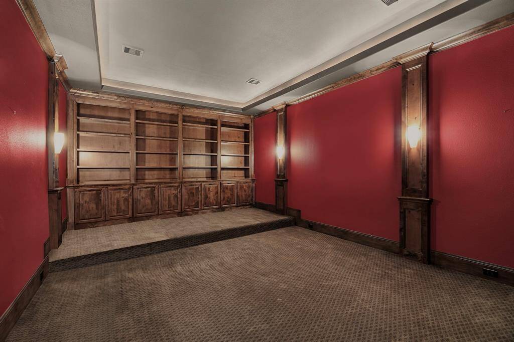 A theater room that provides an immersive cinematic experience, elevating movie nights & sports viewing to a new level.