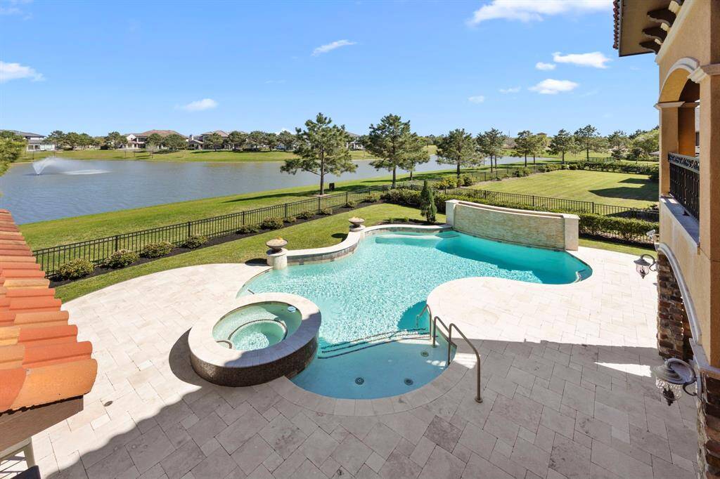 Lose yourself in the serene views with soothing sounds of water flowing. Natural stone travertine expands the outdoor spaces offering luxurious places to relax & entertain.
