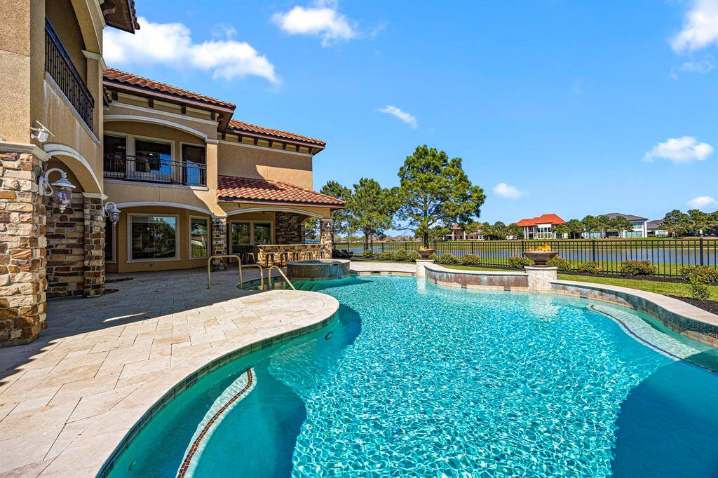 Luxurious and amenity-rich, a resort-style pool designed to offer a vacation-like experience where sparkling blue waters almost touch the skies.