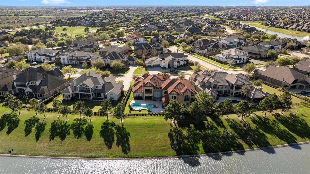Nestled in the exclusive Lago Verde Estates enclave, this palatial waterfront estate captures the stunning beauty & elegance of European design & luxury.