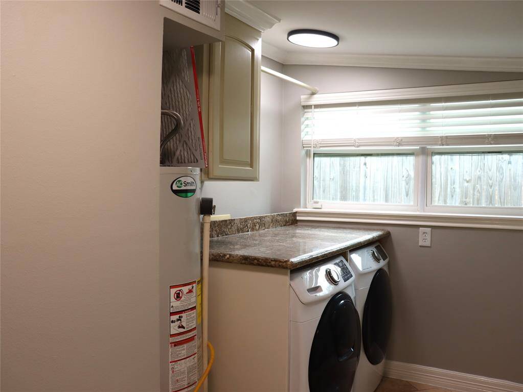 Utility room.  Front loading washer and dryer to stay.
