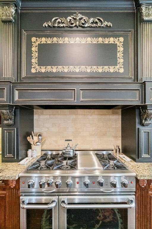 Capital 6 burner gas range with grill, two ovens; one convection, one with rotisserie.