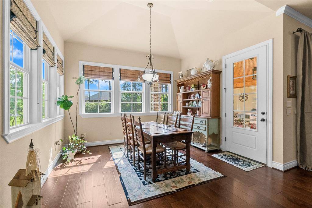 Naturally bright breakfast area with door to outdoor kitchen.