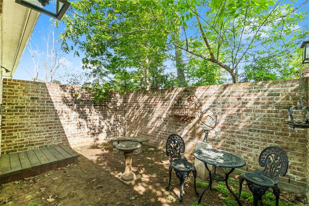 Private courtyard from primary suite with outdoor shower.