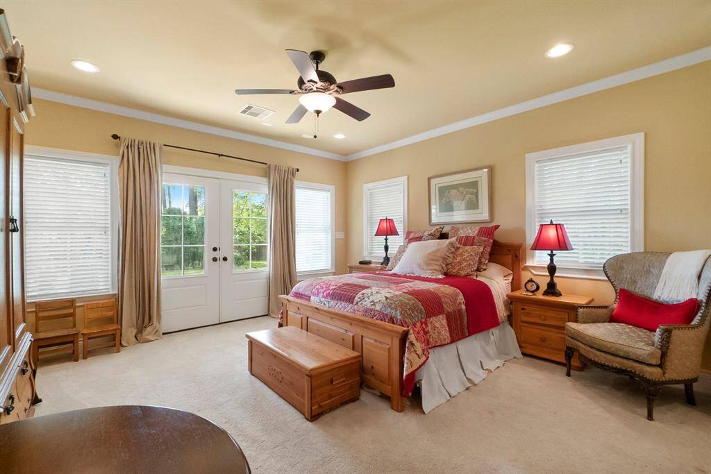 Bedroom 3 in guest suite with French doors to patio.