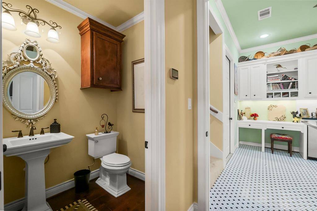 Half bath with entrance to utility room/butler pantry.