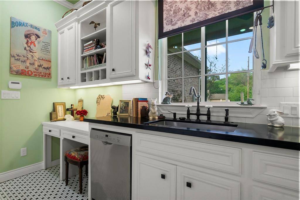 Built in desk, farm sink and 2nd dishwasher in utility room/butler pantry.