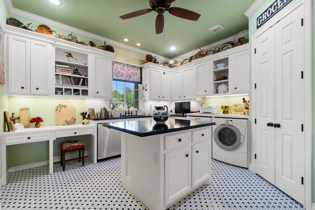 Island with storage and walk in pantry in utility room/butler pantry.  Washer and dryer included.
