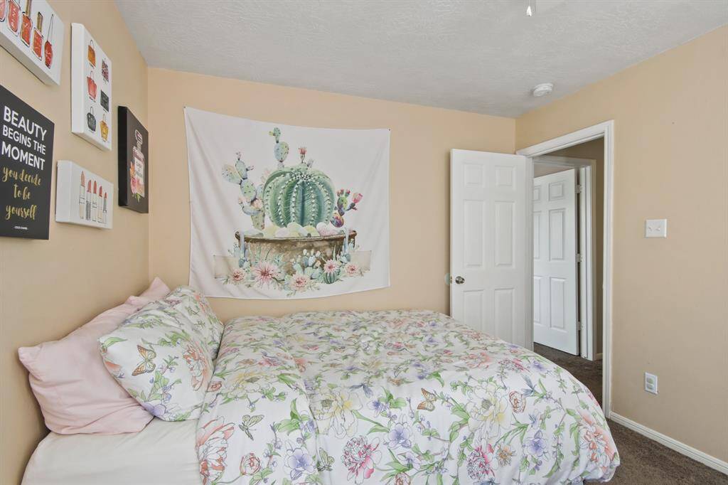 The generously sized third bedroom provides plenty of space, seamlessly blending comfort and functionality.
