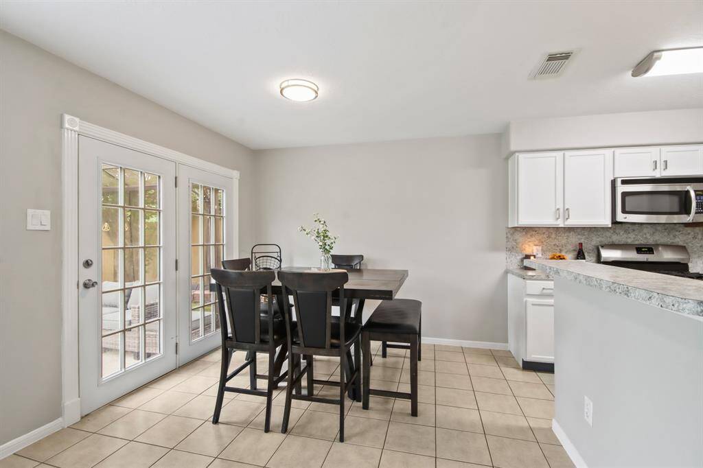 The dining area, conveniently located next to the kitchen and living room, offers plenty of space for a large table—perfect for family meals and gatherings!