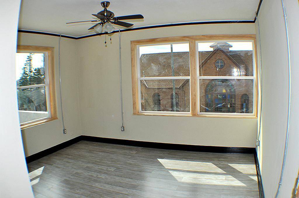 Second bedroom with views to the street. Open the windows for a Gulf breeze. New fixtures throughout.