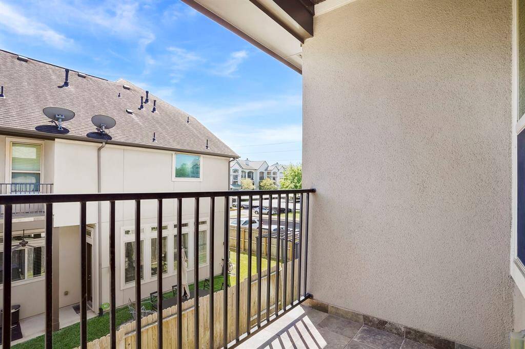 Large primary bedroom with private balcony.  Double doors welcome you to this luxurious bathroom.