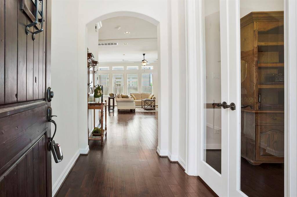 Gracious entry with hardwood floors and a private office to your right.
