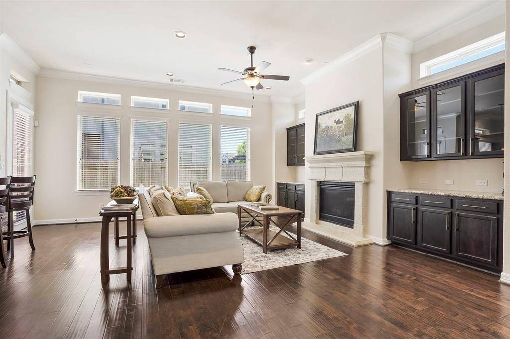 Beautiful built-ins on either side  accentuates the gas log fireplace.