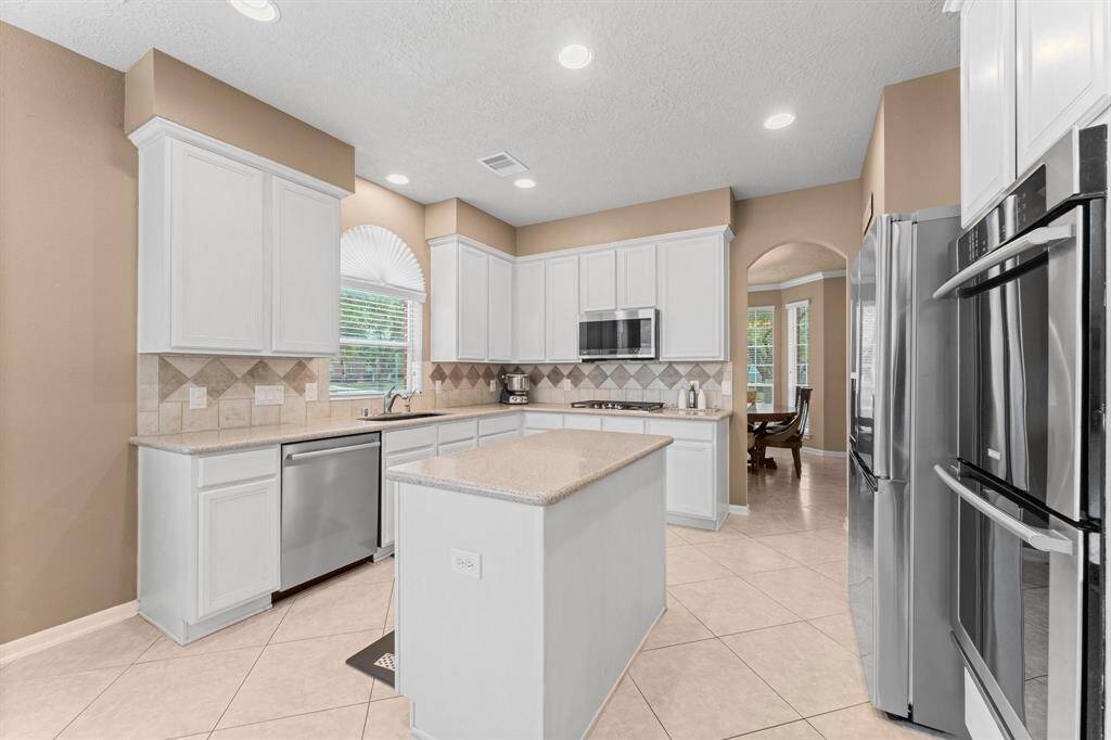 Large kitchen with an island and ample counter space