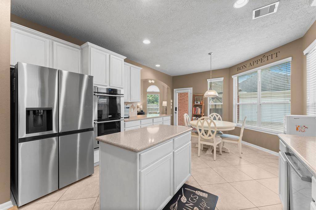 Updated appliances including a KitchenAid double oven