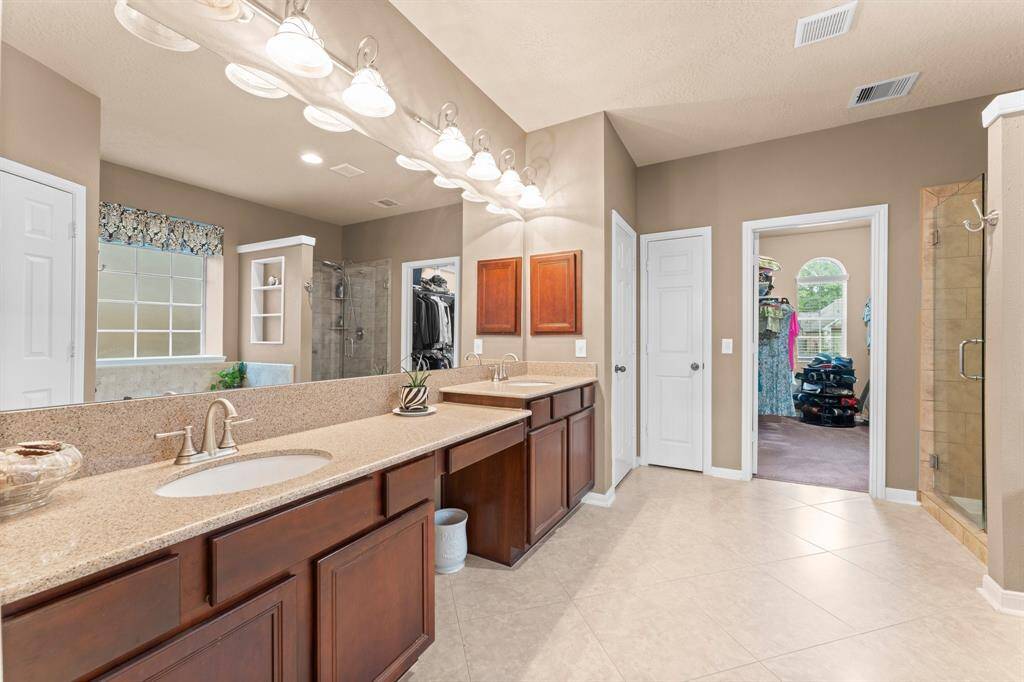Dual sinks, 2 linen closets and a large walk-in closet
