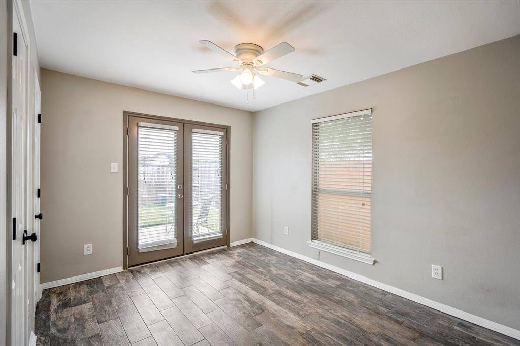 3rd bedroom / office with doors to the backyard