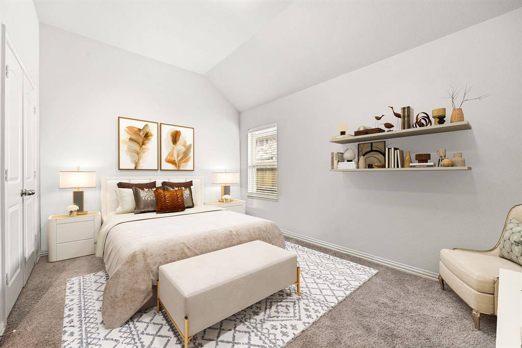 Bright and airy bedroom with a vaulted ceiling, plush carpeting, and abundant natural light. *Virtually Staged