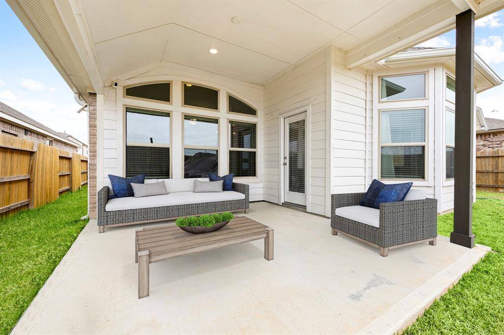 Come and see this spacious backyard with its beautiful covered patio and paved walkway down the side yard. There is plenty of room for the kids to play and adults to relax! Perfect for your outdoor living space, patio furniture, bbq pit, and so much more. The possibilities are endless! *Virtually Staged