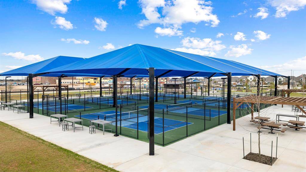 Covered pickleball courts designed for year-round enjoyment, offering residents a fun and active lifestyle right in their own community.