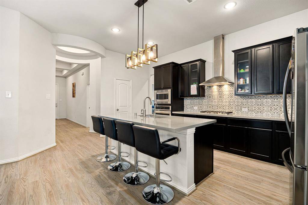 Any chef's dream, this stunning kitchen is perfect for everyday life as well as entertaining family and friends! Extra large kitchen island is perfect for conversation or that much needed space to lay out your party spread for everyone to enjoy! Large windows provide lovely views of your backyard and plenty of natural lighting throughout the day.