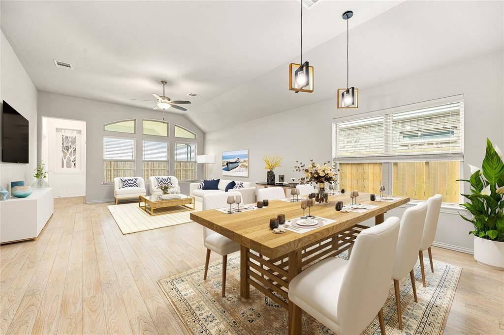 Gather the family and guests together in your lovely living room! Featuring soaring high ceilings, recessed lighting, dark stained ceiling fan, custom paint, gorgeous tile floors and large windows that provide plenty of natural lighting throughout the day. *Virtually Staged